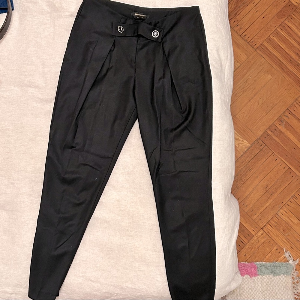 Roberta Biagi black pants, loose at the top and tight at the bottom.